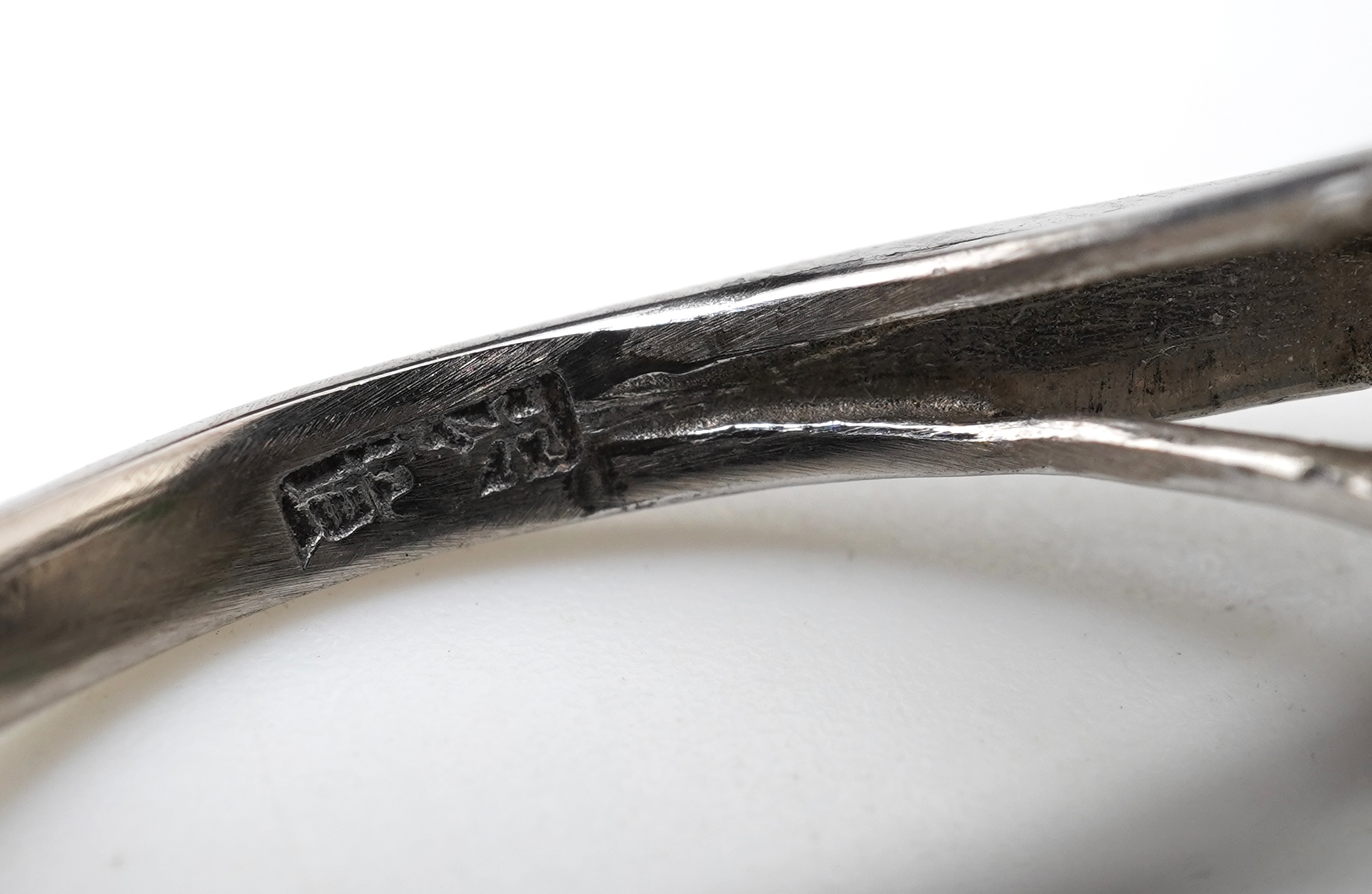 A jadeite and diamond ring